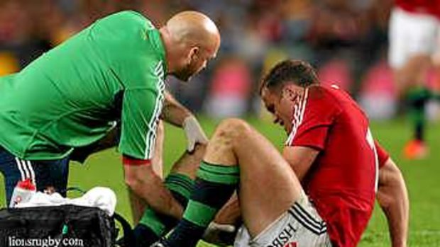 Out: Jamie Roberts receives medical attention against the Waratahs.