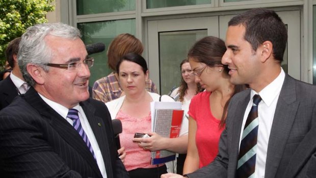 L-R: Independent MP Andrew Wilkie shakes hands with Australian Marriage Equality national convener, Alex Greenwich, at the end of a doorstop commenting on same-sex marriage at Parliament House Canberra.