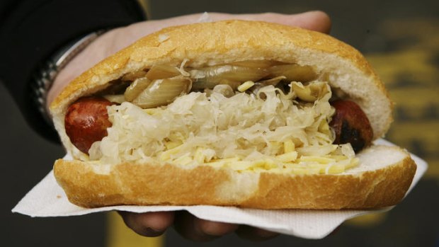 A fine Melbourne dining tradition: A sizzling bratwurst from the Victoria Market.