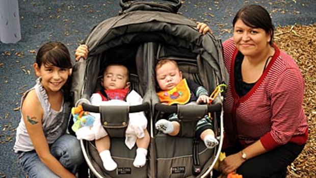 Karina Lidonni with her children, Jacinta and six-month-old twins Andrew and Matthew at Moomba yesterday.