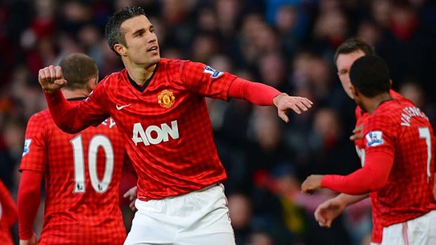 Inspired start to his Old Trafford career ... Robin van Persie celebrates after scoring against Sunderland.