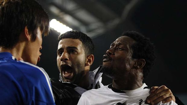 Tempers boil ... Park Hyun-bum, left, of Suwon Bluewings argues with Al-Sadd players.