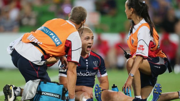 Rebel yell: James O'Connor of the Melbourne Rebels has treatment during Friday night's match against the Brumbies.