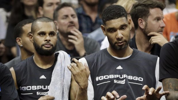 In harmony: San Antonio Spurs won five championships during Tim Duncan's career, including teaming up with Patty Mills for the 2013-14 title.
