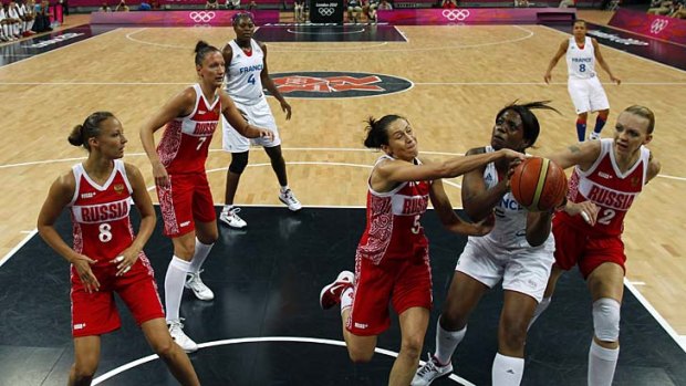 French centre Endene Miyem, second from right, vies with her Russian opponents.