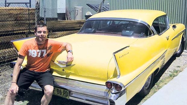 New toy: Cadel Evans and his Cadillac Coupe, a gift for winning the Tour de France.
