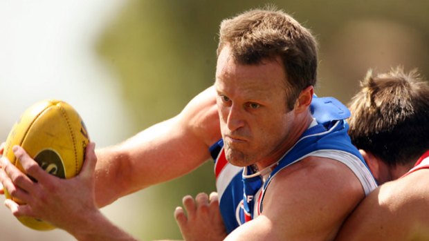 Chris Grant, who last played in 2007, will be back in the action at Whitten Oval next season in amentoring role as the Bulldogs chase that elusive flag.