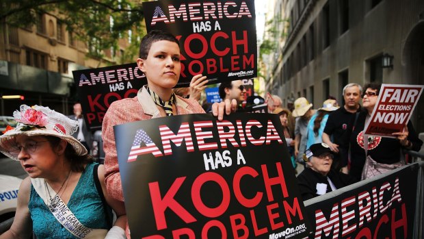 Activists hold a protest near the Manhattan apartment of billionaire and Republican financier David Koch in New York City last year. 