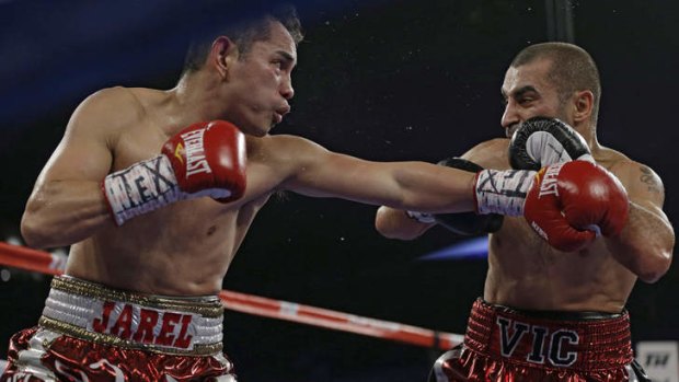 On the receiving end: Nonito Donaire, left, lands a punch on Vic Darchinyan.