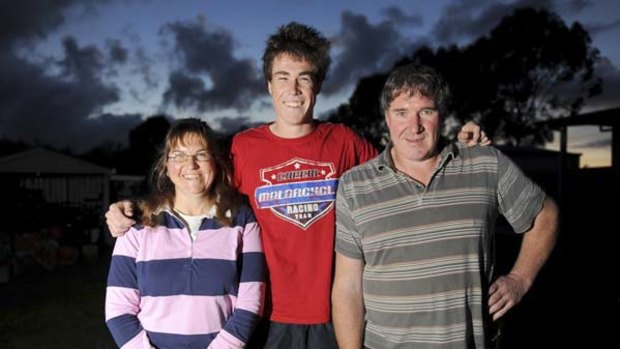 Promising young footballer Jeremy Cameron with his parents Kelly and Leon at their home in Dartmoor.