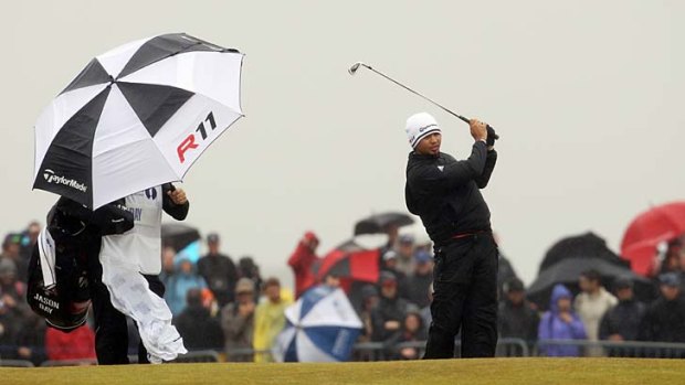 Wet 'n' wild: Australia's Jason Day tees off in the tough weather at the British Open.