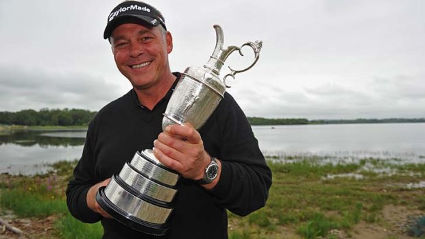 Past glory &#8230; Darren Clarke with the British Open trophy last year.