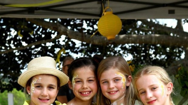 Molly Morrison, 11, Sophie Jara, 9, Lucy Thomson, 11, and Adelaide Pollard, 9, friends of the Baden-Clay girls at the annual family day raising money.