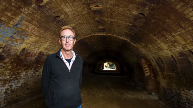 Artist Peter Vandermark inside one of the remarkable abandoned kilns at the brickworks site.