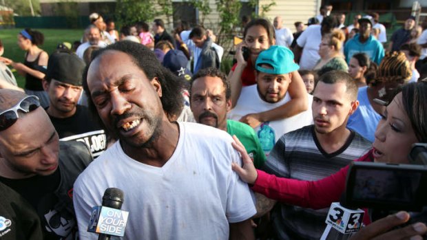 Free burgers: Charles Ramsey speaking to media near the home where missing women Amanda Berry, Gina DeJesus and Michele Knight were rescued in Cleveland.
