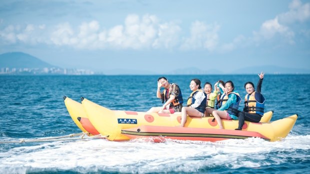 Enjoy plentiful water sports like the banana boat ride while on Wuzizhou island.