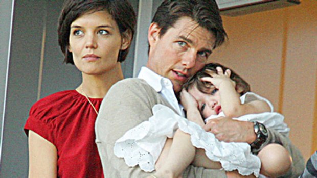 You'd think she was an only child ... Tom Cruise with wife Katie Holmes and their daughter Suri Cruise.