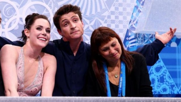 Blame game ... Canada's Tessa Virtue and Scott Moir wait for their score with their coach Marina Zoueva in the figure skating ice dance free dance at Iceberg Skating Palace.