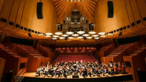 The World Orchestra conducted by Sir Simon Rattle during reharsals in the Concert Hall at the Sydney Opera House.