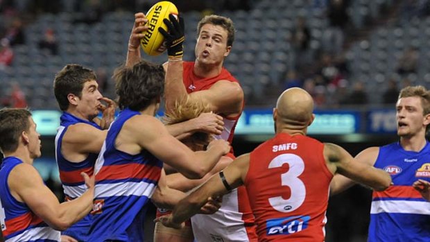 Standing tall: Swan Mike Pyke marks unopposed in a mismatch against shorter Bulldog opponents.