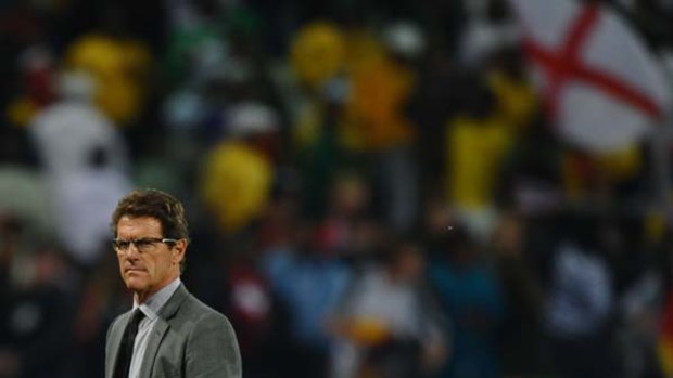 England's coach Fabio Capello looks dejected after the defeat.