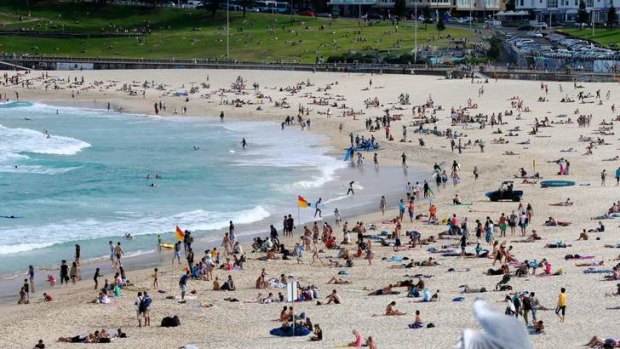 Unseasonable: Swimmers at Bondi Beach take advantage of another warm Autumn day.