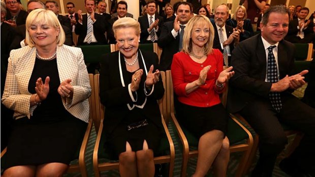 The Coalition joint party meeting applauds after Prime Minister elect Tony Abbott's address, at Parliament House in Canberra.