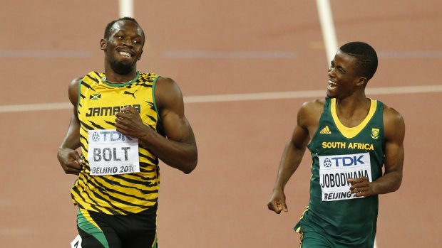 Usain Bolt (left) and South Africa's Anaso Jobodwana share a laugh after the men's 200m semi-final.