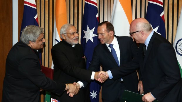 Anil Wadhwa, Secretary (East) Ministry of External Affairs, Indian Prime Minister Narendra Modi, Prime Minister Tony Abbott and Attorney-General Senator George Brandis at Parliament House in Canberra last year.
