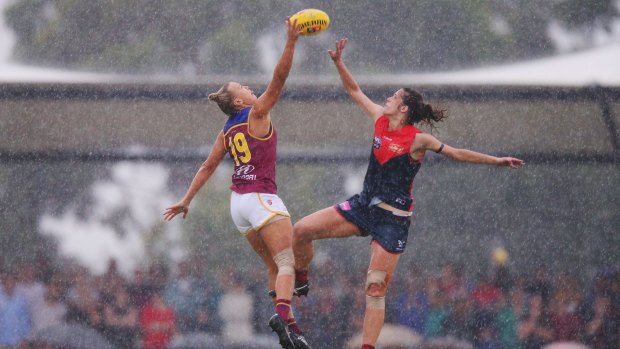 MELBOURNE, AUSTRALIA - FEBRUARY 05: Selina Goodman of the Lions (L) wins the tap in the ruck during the round one Women's AFL match between the Melbourne Demons and the Brisbane Lions at Casey Fields on February 5, 2017 in Melbourne, Australia. (Photo by Michael Dodge/Getty Images)