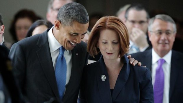 Close allies: Julia Gillard and Barack Obama leave the House of Representatives after the President's address yesterday.