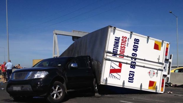 A truck rolled on the inbound entry ramp on the Bolte Bridge causing traffic mayhem.