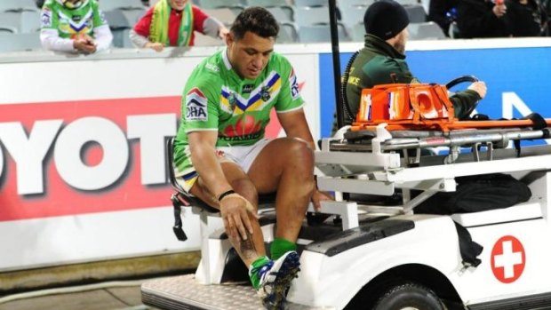 Josh Papalli leaves the field injured against the Broncos.