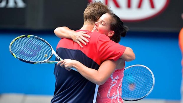 Through ... Jarmila Gajdosova embraces Matthew Ebden after the pair booked their place in the mixed doubles final with a win against Yaroslava Shvedova and Denis Istomin on Friday.