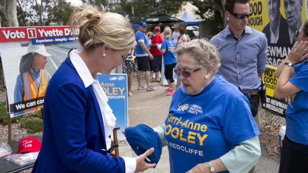 LNP candidate Kerri-Anne Dooley among how-to-vote card vendors at the Redcliffe by-election.