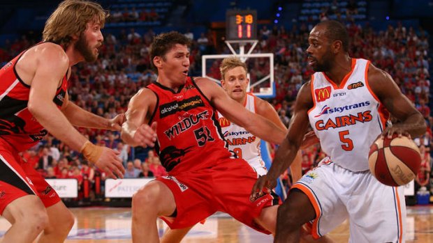 Perth guard Damian Martin looks to hold out Cairns counterpart Jamar Wilson during the round six NBL match between the Wildcats and the Taipans at Perth Arena.
