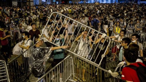 Protesters tie together barricades during pro-democracy demonstrations.