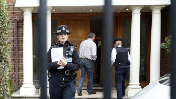 British police enter the home of Altaf Hussain in Edgware, north London.