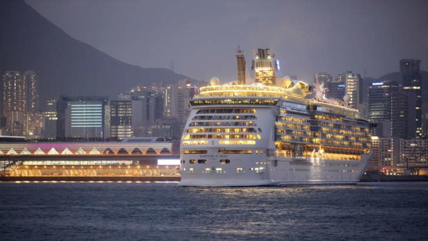 The Mariner of the Seas, right, one of the Voyager-class vessels of Royal Caribbean International, docks at the new Kai Tak Cruise Terminal.