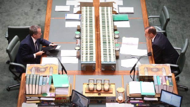 Prime Minister Tony Abbott and Opposition Leader Bill Shorten talk across the table during question time on Tuesday.