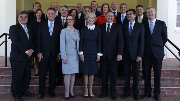 Governor-General Quentin Bryce poses for photos with Prime Minister Julia Gillard and her new-look ministry after the swearing-in ceremony.