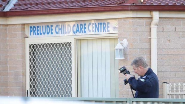 Forensic officers at the home ... the house was also being used as a child care centre.
