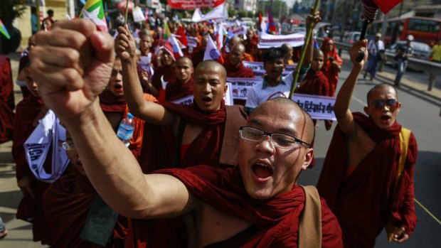 Buddhist monks and others protest in Yangon on Wednesday to demand the revocation of the right of holders of temporary identification cards, known as white cards, to vote in a referendum. 