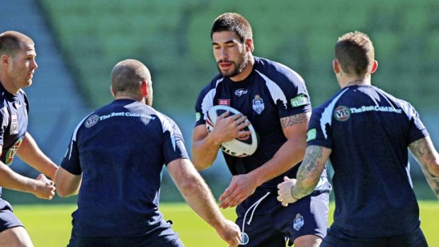Learning the drill ... James Tamou gets together with fellow Blues at training before Wednesday's Origin opener at Etihad Stadium.