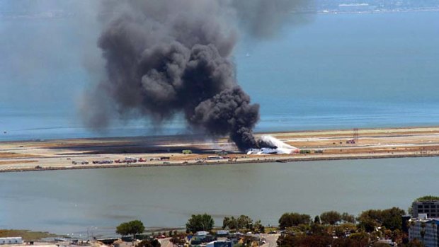 Smoke billows into the air just moments after the crash.