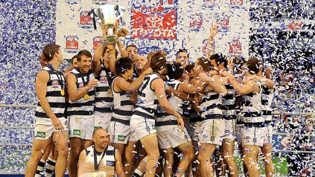 Geelong players enjoy the moment after Saturday's grand final victory.