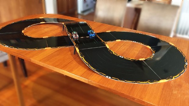 The figure-8 track is about four feet across, but don't spread the risers like this – place them as close together as possible to reduce the chances of your cars losing it as they come down the drop. Regardless of your design, you cars will spin off the track so it's best to race on the floor.