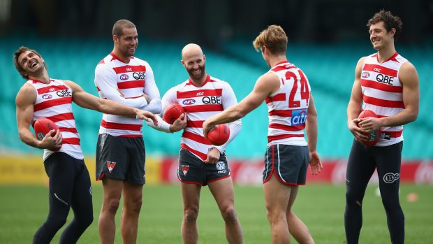 Josh Kennedy, Lance Franklin, Jarrad McVeigh, Dane Rampe and Kurt Tippett share a laugh during a Sydney Swans training session at the SCG on Tuesday.