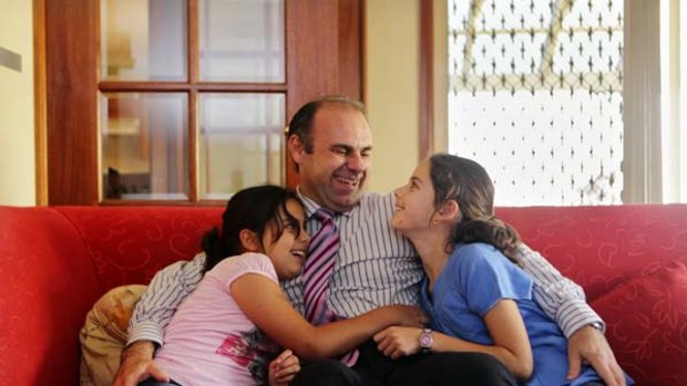 "My advice is, get everything in writing" ... Richard Aguiar, who has fought Bankstown City Council for five years, with his daughters, Olivia, left, and Amelia.