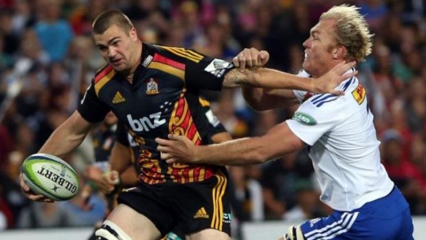 Rugged defender: Schalk Burger brings down Liam Squire of the Chiefs.